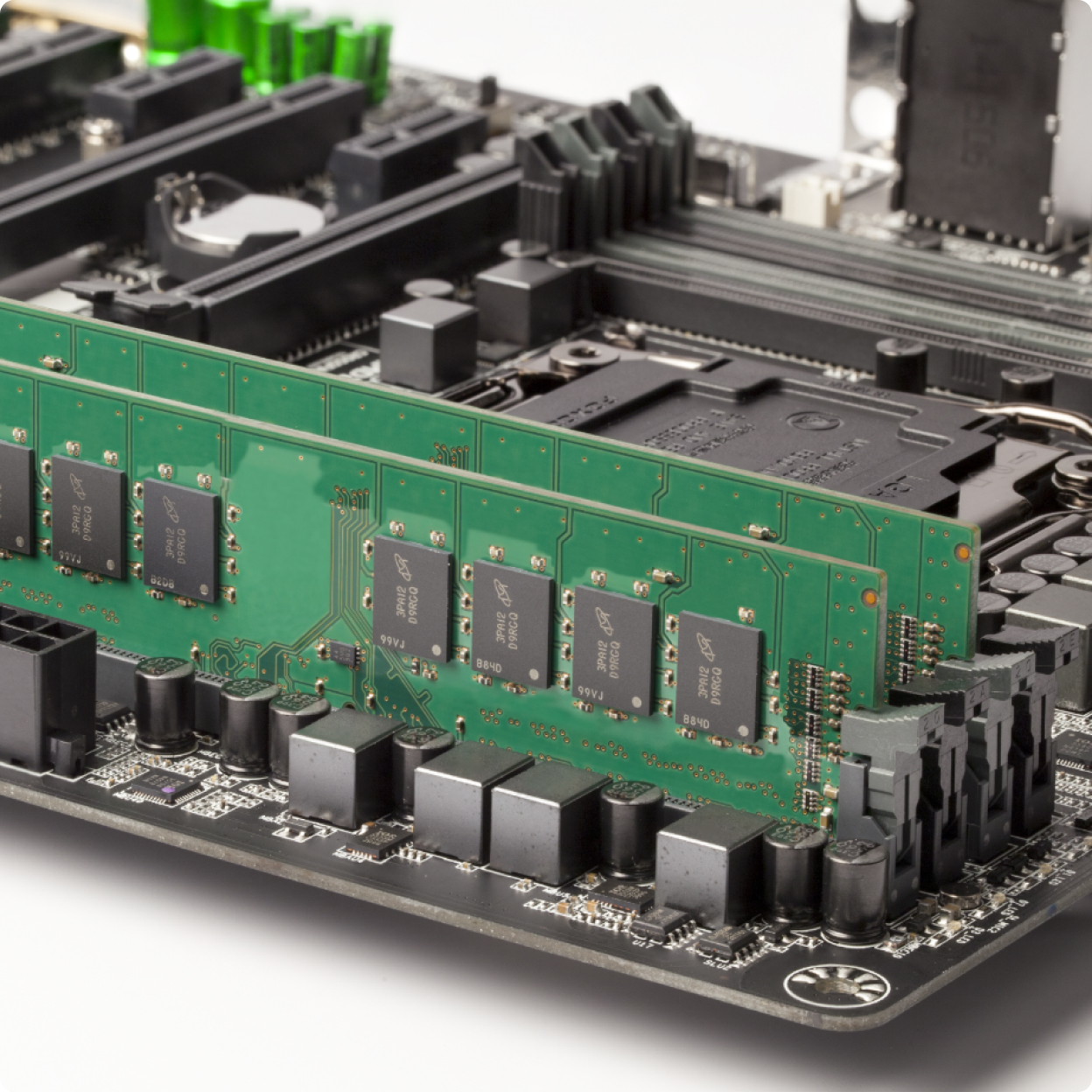 Close shot of a black Crucial DDR5 Pro DRAM being installed into a white gaming PC.