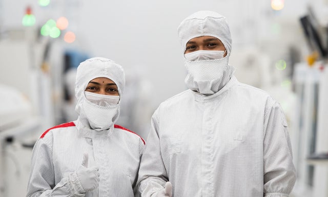 Fab workers in bunny suits
