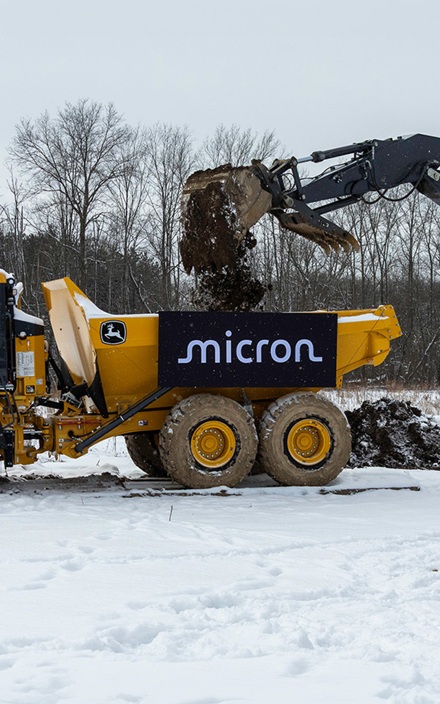 Construction equipment at Micron’s 2026 New York groundbreaking site symbolizing U.S. expansion.