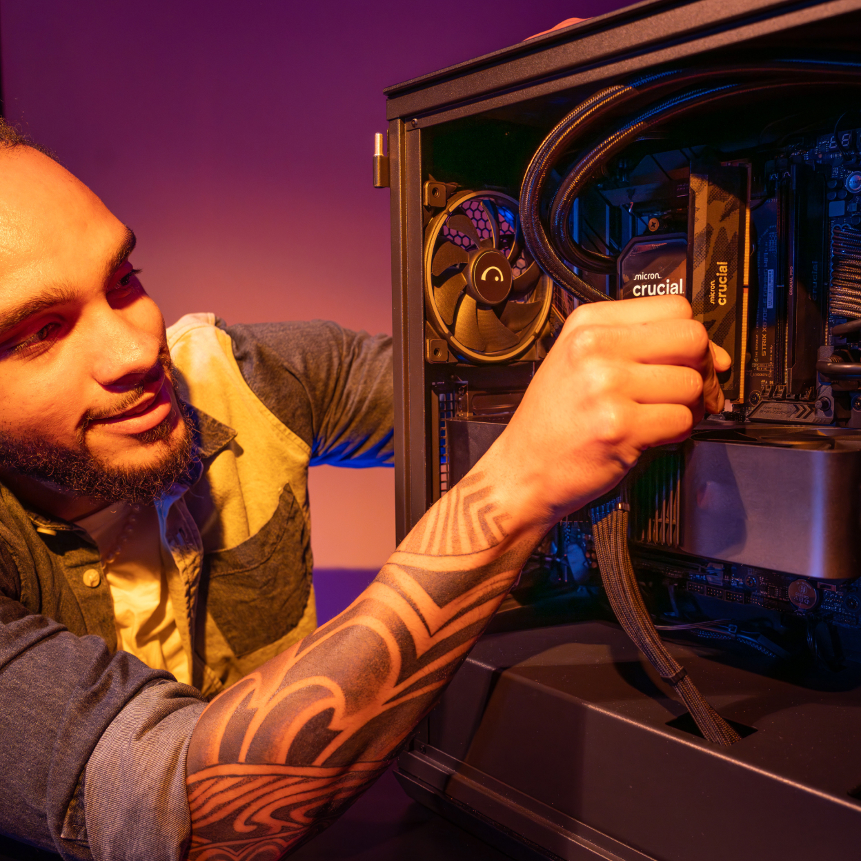 A black Crucial Pro DDR5-6400 resting on top of a motherboard with additional Crucial DRAMs installed.