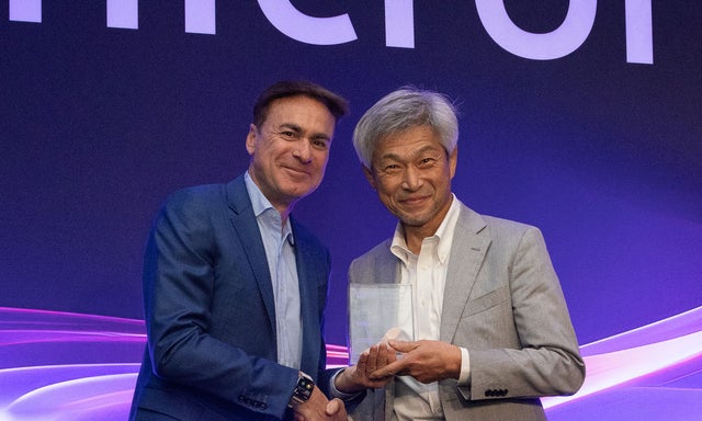 Ben Tessone presenting the award to noboru yoshinaga