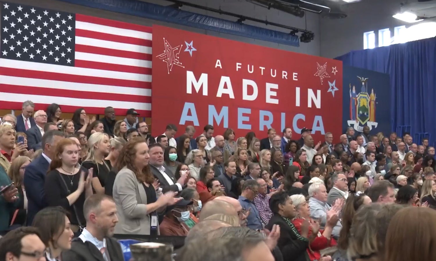 A crowd sitting in front of flags at Micron's Workforce of the Future event.