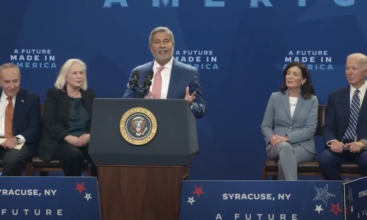 Micron Chairman, President and CEO Sanjay Mehrotra speaking at the podium at the Micron event.