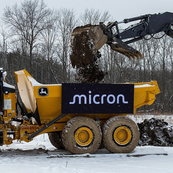 Micron facility ground breaking. Micron sign on a dump truck.