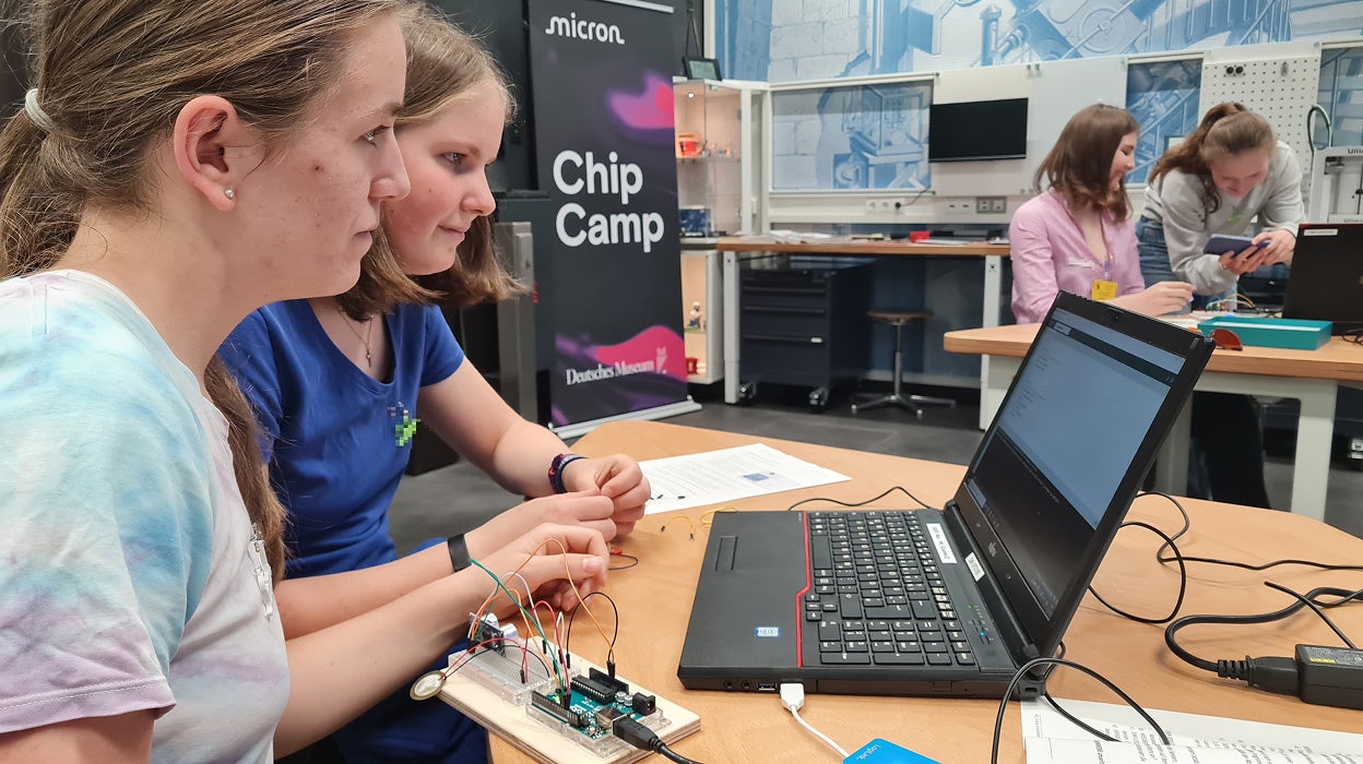 Students working on electronics projects at Micron Chip Camp.