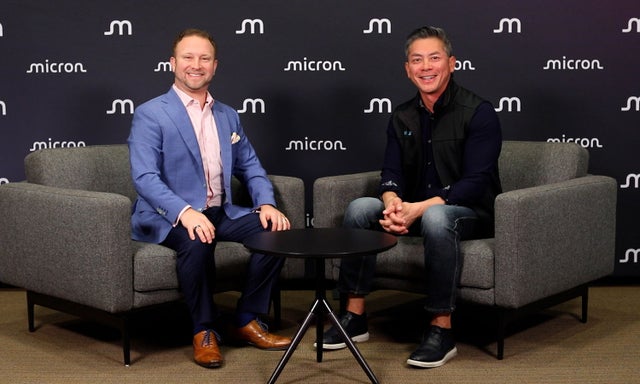  Jeremy Werner on the left and Avery Pham on the right both sitting on the chair 