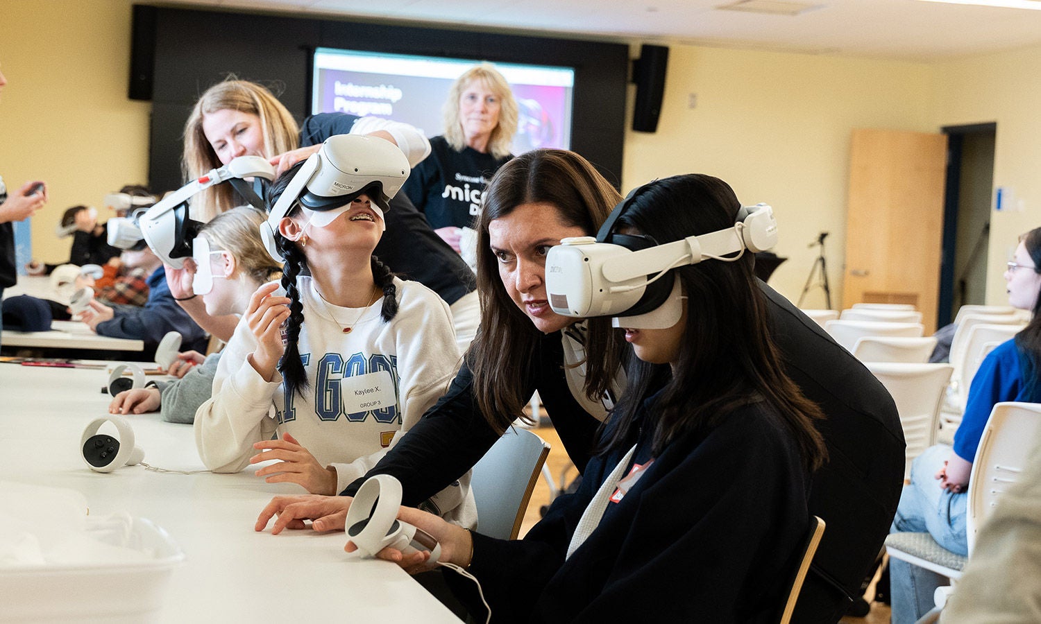 Students using virtual reality headsets during a classroom workshop.