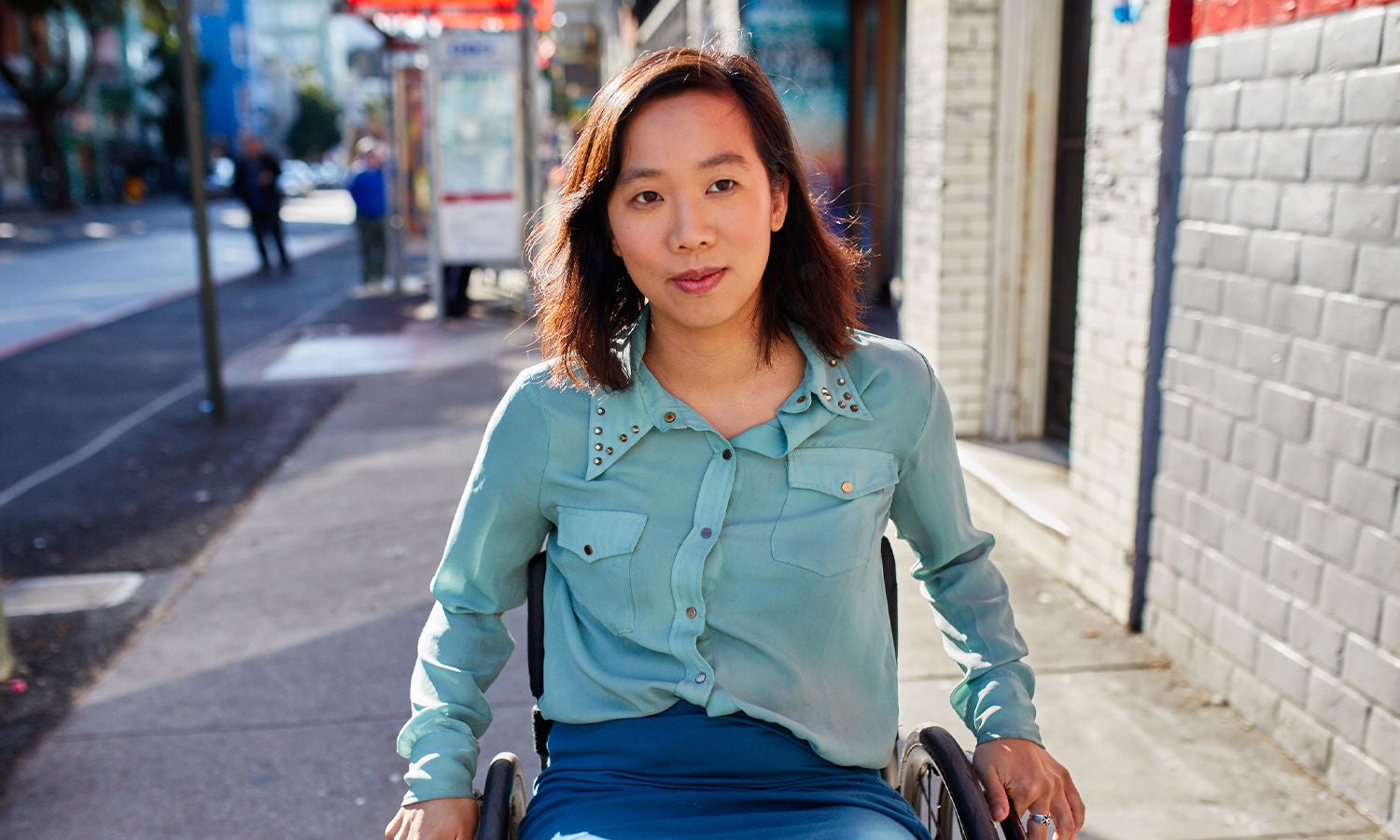 Group of 3 people looking at the paper