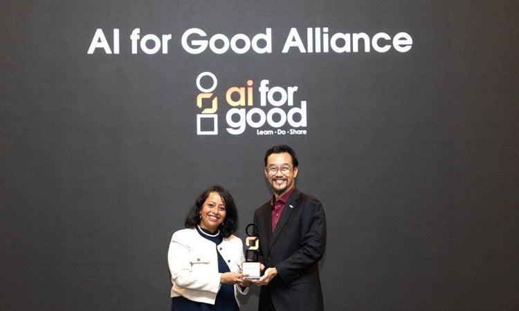 AI for Good Alliance award presentation at a recognition event.