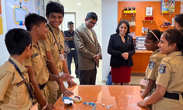 A group of young people wearing Rosita uniforms at a STEM event