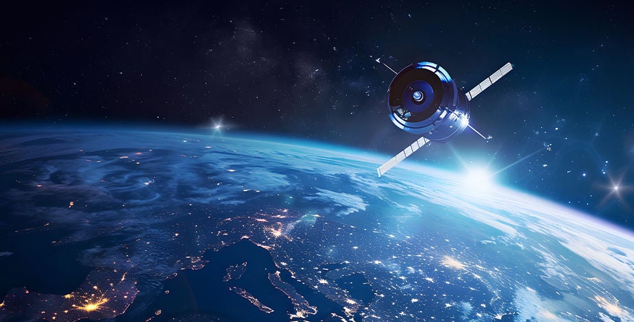 Satellite orbiting planet haloed in light