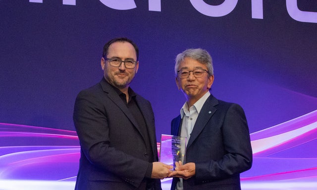 John Whitman presenting the award to Steven shimada