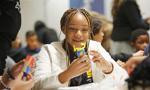 A young person engaging in a STEM activity