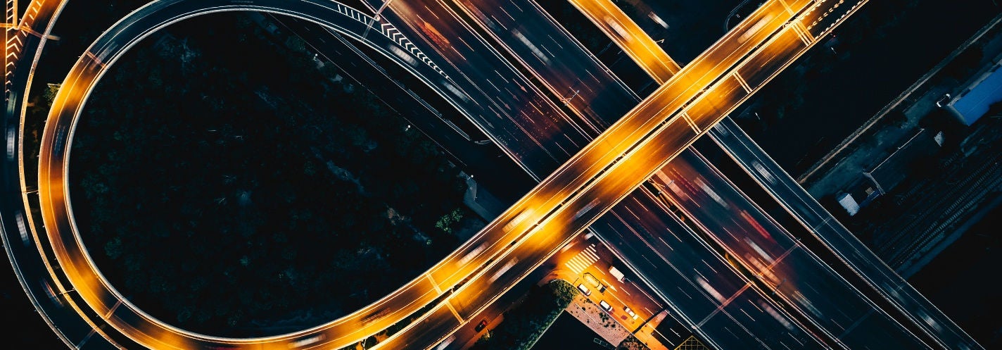 image of highway with traffic and lights
