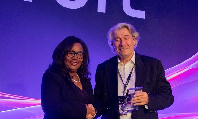 Fran dillard presenting the award to Dr Wolfgang buechele 