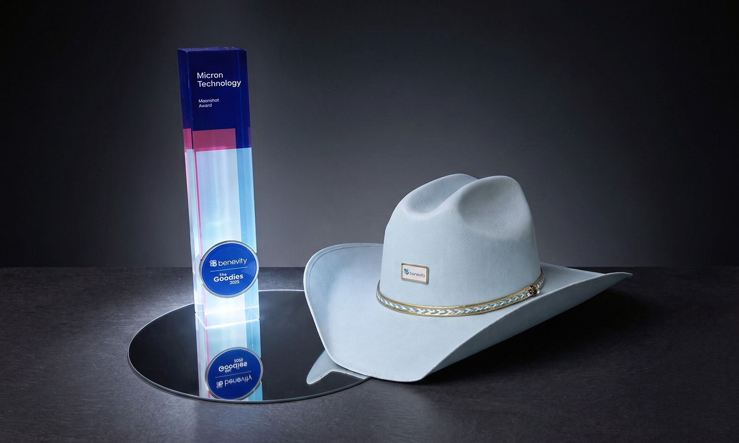 Award trophy and white cowboy hat displayed on a table.