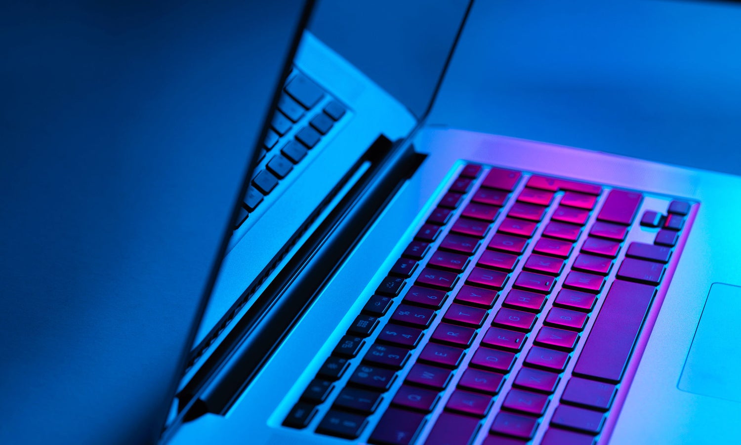 Computer keyboard in colourful background 