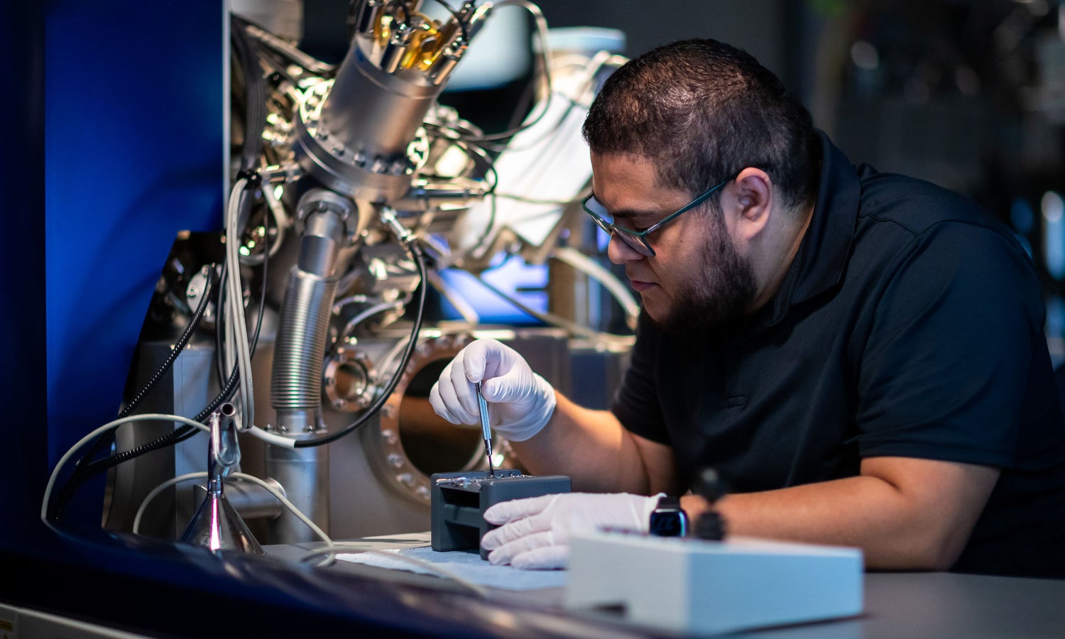 Man in a surface analysis lab