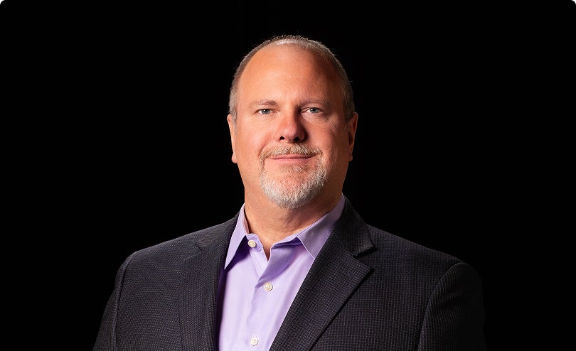 Headshot of Greg Routin