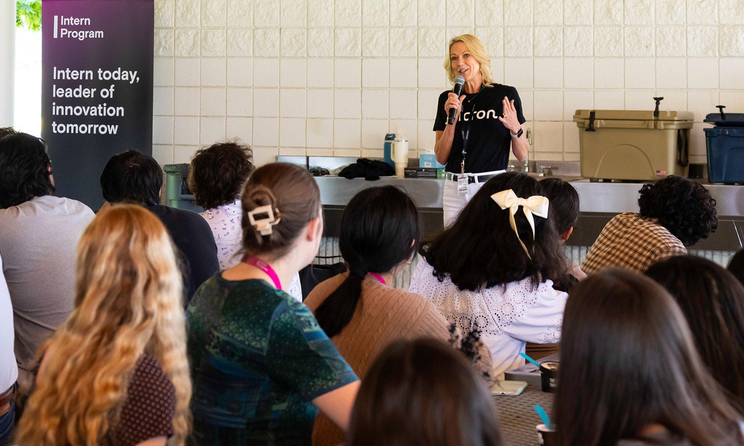 April Arnzen speaking to an audience of interns