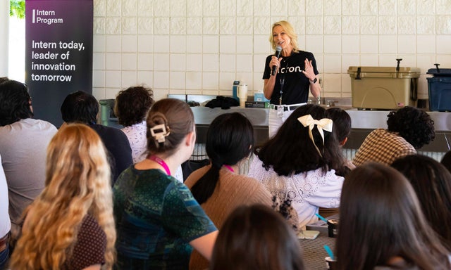 April Arnzen speaking to an audience of interns