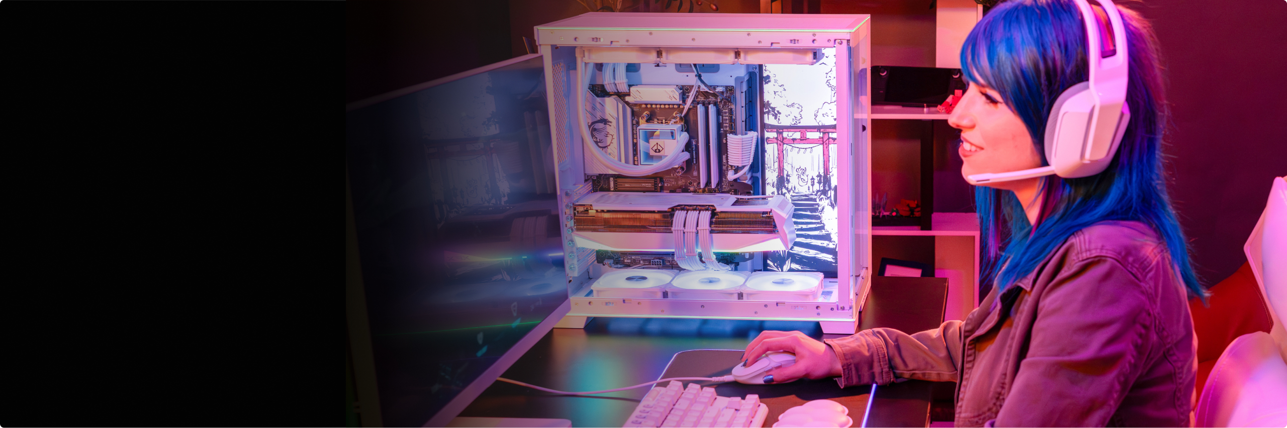 Gamer looking at PC screen with headphones on with blue and purple lights