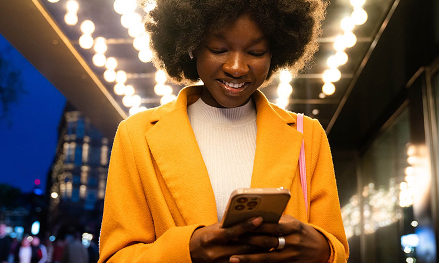 women looks delighted using the cell phone