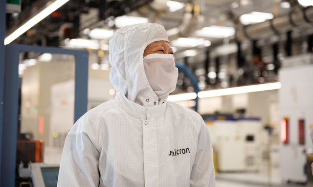 Man with mask in clean room