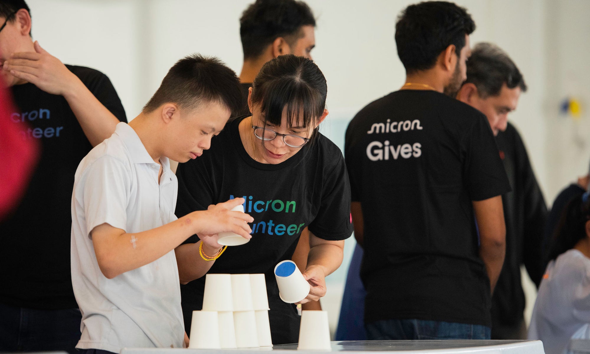 Micron volunteers guiding a hands-on learning activity
