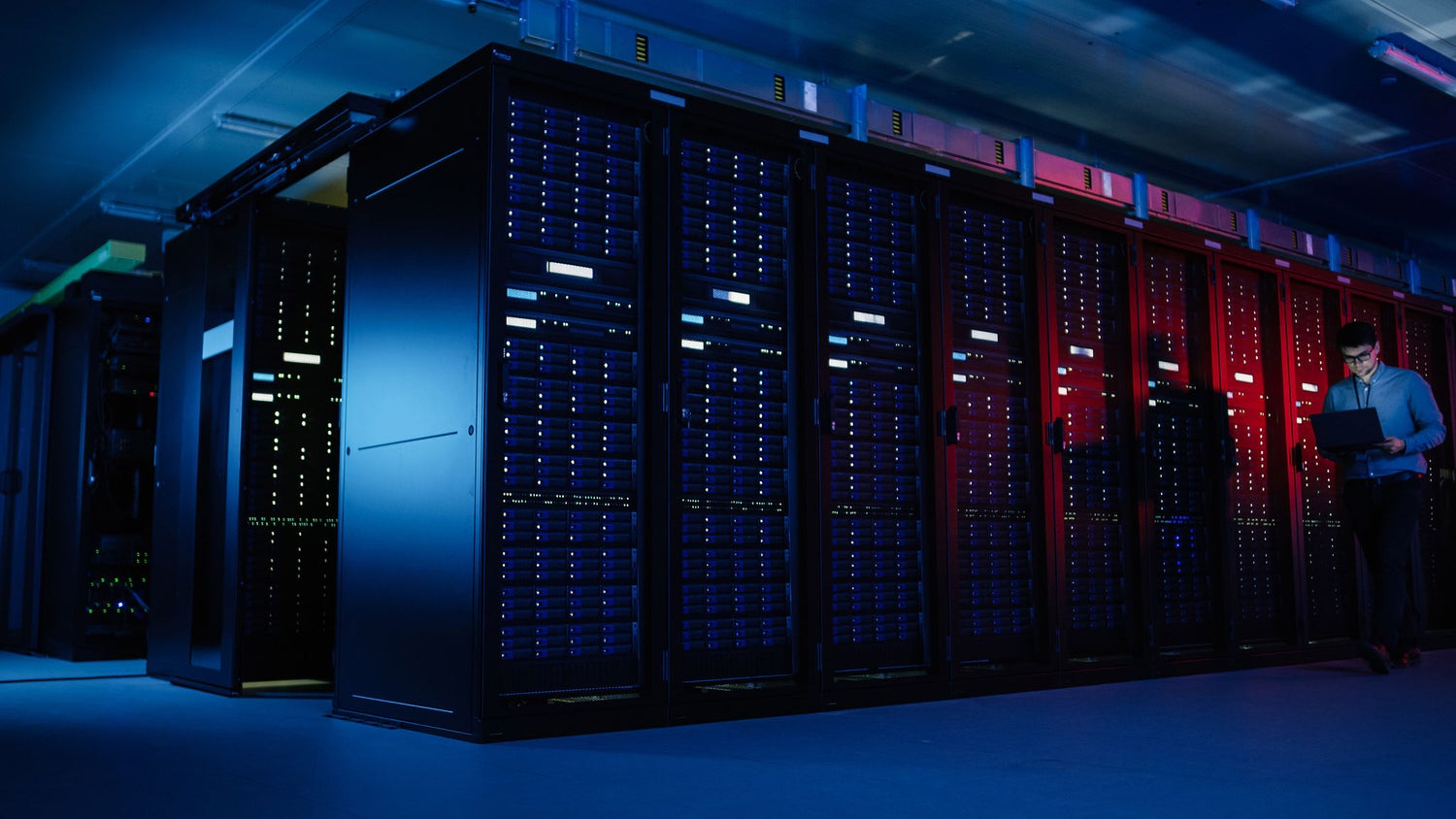 Data center server racks with blue and red lighting