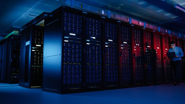 Data center server racks with blue and red lighting