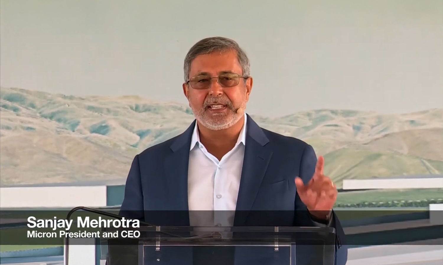 Micron Chairman, President and CEO Sanjay Mehrotra speaking at a podium during Idaho fabrication plant groundbreaking ceremony