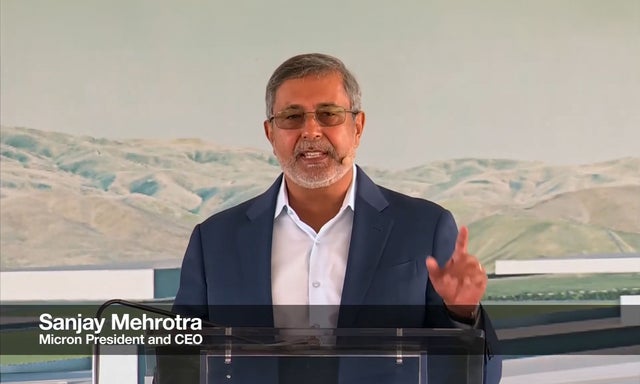 Micron Chairman, President and CEO Sanjay Mehrotra speaking at a podium during Idaho fabrication plant groundbreaking ceremony