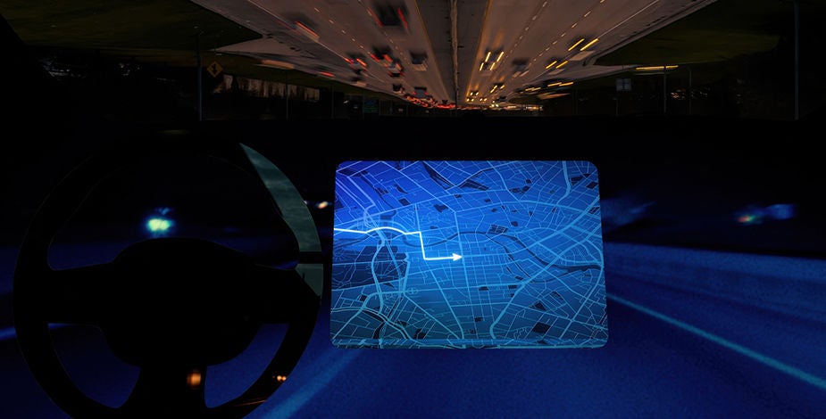 Driver’s view of a modern car interior with digital dashboard and inverted nighttime highway