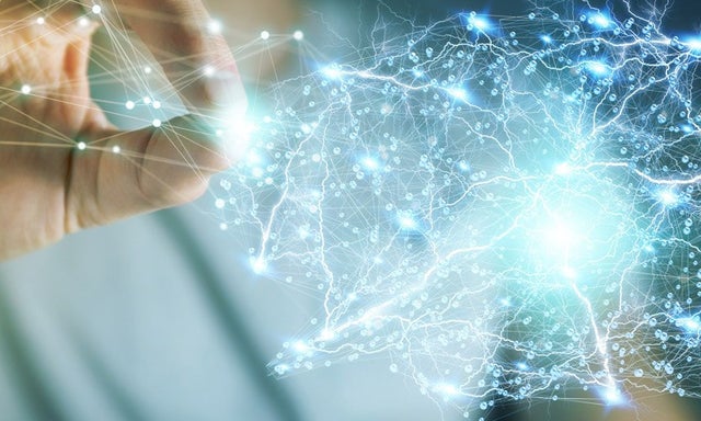 Hands holding a digital AI brain with connected neural network